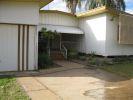  20 KITCHENER ST CLERMONT, QLD 4721 Gosh remember back in the days of She-Ra and He-Man!! With their swords of protection and power, they were indestructible.  Reminds me somewhat of this house...indestructible...as solid as a rock!!  And not just solidly built either, but a solid layout...three large bedrooms, all with built ins and all along the eastern side of the house.  There is a lockable garage at the front along the western side of the house, and alongside this is an additional carport.  An awesome entry porch with access to the garage, and lockable storage units invites you into the home.  The open plan living & dining areas are in the centre of the house, and are huge, with built in shelving and shadow features.  In addition there is the well equipped kitchen with a servery opening onto the dining area.  From the dining area, head down a few stairs to the entertaining area.  Behind the kitchen is a large storage cupboard and laundry with a ramp down to the clothes line.  