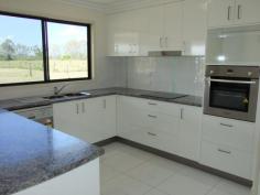 .Yengarie, Qld 4650.Built by 2014 Master Builders Award Winner Dirran Knight (Knight 
Constructions Qld) – winner of the 2014 Burnett Wide Bay "Rising Star 
Award”, this lovely and new four bedroom home is waiting for its new 
owners. 
 

 Positioned towards the rear of a three acre fenced allotment which 
comes complete with a three bay shed and a lovely rural outlook, it 
won’t be waiting long! 

 Just completed this four bedroom home is located approximately ten minutes from the CBD. 

 The main bedroom features an ensuite with dual shower and walk-in 
robe while the additional three bedrooms all have built-in robes. 

 Quality fixtures and fitting and floor coverings have been installed 
throughout. The kitchen, dining and lounge area is open plan in design 
and large modern tiles feature throughout the main traffic areas. 

 The custom built kitchen which overlooks the rear deck boasts plenty 
of bench space, dishwasher and a generous pantry. The rear hardwood 
deck/entertainment area is fully lined, has lights and a ceiling fan and
 is positioned to catch the afternoon breezes. The outlook across the 
neighbours dam is lovely to look at while entertaining family and 
friends. 

 There is underground power to the house and a large 10.6m x 7.5m shed
 takes care of vehicle accommodation and workshop requirements. 

 “Brand new and waiting for you.” 
 
