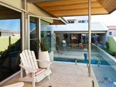  11 Florence St Cottesloe WA 6011 RESORT ELEGANCE AND ENTERTAINERS DELIGHT 
			
			
				This John Lewis designed four bedroom plus gym, three bathroom 
spacious home, over three levels is an entertainers dream and everything
 a family could want. The elevated 462m2 block is just walking distance 
to the beach and all of the spoils of the Cottesloe cafes and shopping 
district. Orientated around an azure blue lap pool this show stopping
 home is an entertainment retreat divided in to six separate living 
zones, four of which connect through commercial stackback glass doors. Exceeding
 all lifestyle requirements, it has an openness that flows between two 
outdoor kitchens over a modern open plan living space while retaining 
excellent separation between all bedrooms. The master suite enjoys a 
private balcony and direct access straight in to the pool, as well as a 
resort style ensuite bathroom and large walk in wardrobe plus mini-bar. At
 the top of a soaring travertine feature wall, the kids have their own 
private wing with a spacious lounge area and double size bedrooms all 
with built in robes. Guests are not forgotten either with the lower 
ground floor dedicated to making their stay enjoyable. Not only do they 
have their own bathroom, but they are located right next to the large 
walk in wine cellar. The outstanding galley kitchen is custom 
designed to provide you with the ultimate cooking experience. As with 
everything in this stunning home, only the highest quality appliances 
have been selected with the inclusion of Smeg espresso machine, 
dishwasher, fridge, upright oven and microwave. If you can prize 
yourself away from the amazing kitchen, you can enjoy an outdoor lunch 
under the cedar lined patio by the pool or dinner and a sunset beside 
the outdoor kitchen at the front. Designed to deliver the ultimate 
entertaining lifestyle, this deserving home also offers excellent 
separation and privacy for the whole family. -4/5 bedrooms -3 bathrooms plus powder room -Spacious and light open plan dining, living and kitchen area -Modern chefs kitchen with Smeg appliances -Separate upstairs living area with drop down screen and surround sound speaker system -Bright and airy master bedroom wing with its own under cover pool balcony, walk-in robes and resort style bathroom -Elegant stone cladding and large windows, high blade walls and wood lined surfaces, offer the best of everything. -2 separate alfresco entertaining areas. 1 with an outdoor kitchen and 1 with built-in barbecue. -Resort style swimming pool -2 car garage and plenty of storage 