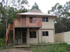  32 Alexander Street Macleay Island Qld 4184 This fabulous looking little home is a great buy. Spotlessly neat and tidy, ready to move into, presently like new, this is a great way to get into the market and stop paying rent, or keep it rented out as it is currently at $175 a week until 20th September 2014 with a fantastic tenant. The home sits beautifully back on the block, surrounded by trees, around the corner from conservation land, private and peaceful. Downstairs is a large room with a kitchen, separate toilet and shower. Upstairs is a room with a toilet and a shower. There is no internal stair case between the two but a cover over the outdoor stairs would solve that issue. If you know someone who would like to get into the market but cannot afford to, direct them to this home, they cannot go wrong.