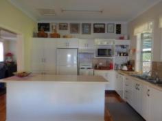  36 Sunnyside Road   Moree   NSW   2400 Sunnyside Treasure!! *Beautiful 2 bedroom home with sleep-out *Both bedrooms have built in wardrobes *Good size sleep-out with built in wardrobes *Spacious lounge room with split system air conditioning *Dining area with tile fire place *Large modern kitchen with adjacent meals area *Central main bathroom with shower over spa bath, vanity, toilet & linen cupboard *Laundry adjacent to sitting room *Generous back deck overlooking the grounds - perfect for outdoor loving *Evaporative air conditioning *Double lock up garage with workshop *Beautifully maintained lawns and gardens with automatic watering system in place *Situated on a 3387 square metre block   