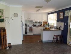  88 Northern Road  Roma Qld 4455 This beautifully presented lowset brick home boasts 4 built-in bedrooms, master with walk in robes and ensuite. Modern kitchen with dishwasher and pantry, separate dining and separate living areas, wood heater, ducted air conditioning plus reverse cycle in main. Large tiled bathroom with separate shower and bath. Fully screened with security doors, new floor coverings, new paint work inside, 2 bay lockup garage, paved and covered outdoor entertainment area leading off into the established lawns and gardens. Two rainwater tanks, separate 3m x 3m garden shed and rear yard fully fenced, all this in a flood free area. 