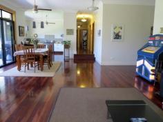 Semi-rural lifestyle with city convenience.!! Park-like, spacious, 
useable grounds with fruit trees, natural bush and extensive parking . 
 900m approx to city train service, restaurant, antique shops, post 
office, general store, community hall and mechanic, parks, tennis courts
 and sporting oval. Walk to highly regarded, child care, public primary school or private school. 3km approx. to a choice of busy shopping centres, pubs and cafes. 
 Extensive bushland walks or mountain bike trails located at the end of 
the street. Shared bicycle / pedestrian path at the front gate. 
Executive style, contemporary home, built for a modern, successful 
lifestyle with views, space and privacy. Frank Lloyd Wright inspired, 
this architect designed 7 yr. old home has the ‘wow’ factor – with 
vistas, light and open plan living, combined with the huge bedrooms, 
ensuite, robes, extensive storage and those other modern essentials that
 make this home a must see. Featuring Jarrah floors, high ceilings, 
super wide eaves, outdoor speakers, tinted windows, paved courtyard, 
underground water tank, under-house storage, sensor lighting and outdoor
 power outlets. The list goes on and on. Energy efficient, 
insulated and low maintenance, the home was built to stringent bushfire 
and environmental standards. Natural gas heating and cooking, vogue 
style kitchen, high speed internet and underground 3 phase power service
 the home, while data and multiple digital TV aerial points abound ( 
including all four bedrooms.) Entry to the property is via a gated 
driveway, lined with established native lilli pillis. There are multiple
 parking areas, plus services available at the swimming pool for the 
visiting caravan or motorhome.
