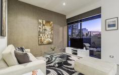  5/918 Hay St Perth WA 6000 One word. Perfect. This chic and sophisticated inner-city apartment ticks all the boxes where style, design and lifestyle are concerned. Located in the “Paris end of town” – the West End, this apartment will not only impress, but is guaranteed to provide you with endless enjoyment for years to come. The perfect space for entertaining, the perfect space for quiet nights in with a glass of red; Apartment Five complements whichever mood or mode you may be in. With its 3 metre high ceilings, polished concrete Terrazzo floors and thoughtful design, this apartment exudes that idyllic urban look and feel and is the perfect accompaniment to your cosmopolitan inner city life. For the savvy investors out there, this property is currently tenanted at an astounding rent of $850 per week. The tenant absolutely loves the apartment and recently re-newed the lease until December 31st 2014. Boasting a generous 83 sqm of internal living space and a large functional 13 sqm balcony, you’ll have plenty of room to spread your wings and indulge with friends – whether it’s catered cocktail parties or intimate gatherings, this apartment delivers. Adding to the overall feeling of spaciousness, the open plan living area is lined with floor-to-ceilings windows, maximising the high ceilings and making each sunset and absolute show stopper. The spacious Master Bedroom includes built-in full height robes with plenty of storage space and en-suite access to the luxurious bathroom with spa bath. The second bedroom provides ample space for multiple uses – a second bedroom, a home office or guest bedroom for friends and family. Quality appointments are featured throughout the apartment – they just don’t make them like this any more. In the kitchen you’ll find gas cooking, stainless steel bench tops, a large 6-burner Smeg cooktop (ideal for any eager chef) and a Smeg dishwasher. Attention to detail has even been given to the lighting, with a combination of contemporary Kreon fittings and an abundance of quality down lights. The bathroom features a Kohler vanity, Grohe fittings and a soft-close Caroma toilet. Further improvements have been made to the property, including an updated ducted reverse-cycle Fujitsu air-conditioner, stunning designer dual roller-blinds to the living area, a sun-blind to the balcony increasing the functionality of the outdoor space and updated shower fittings and toilet, all adding further life to the property. Apartment Five is one of only 30 apartments at the iconic Box Building – known for its architectural intelligence, awards and boutique quality. Ahead of its time when it was built, and it remains a standout inner city building to this day. Step outside and you’ll be within walking distance to the finest Perth has to offer – stroll along King Street and shop at Louis Vuitton, Chanel, Gucci and soon to be, Miu Miu. Then toast the night away at the likes of Print Hall, Bar Lafayette, Wolf Lane or the small luxury hotel, the Terrace Hotel. To inspect this stunning inner-city apartment, please contact Danielle Geagea to arrange your private inspection. 