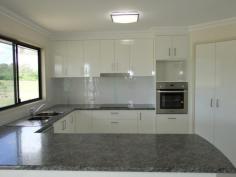 Yengarie, Qld 4650.Built by 2014 Master Builders Award Winner Dirran Knight (Knight 
Constructions Qld) – winner of the 2014 Burnett Wide Bay "Rising Star 
Award”, this lovely and new four bedroom home is waiting for its new 
owners. 
 

 Positioned towards the rear of a three acre fenced allotment which 
comes complete with a three bay shed and a lovely rural outlook, it 
won’t be waiting long! 

 Just completed this four bedroom home is located approximately ten minutes from the CBD. 

 The main bedroom features an ensuite with dual shower and walk-in 
robe while the additional three bedrooms all have built-in robes. 

 Quality fixtures and fitting and floor coverings have been installed 
throughout. The kitchen, dining and lounge area is open plan in design 
and large modern tiles feature throughout the main traffic areas. 

 The custom built kitchen which overlooks the rear deck boasts plenty 
of bench space, dishwasher and a generous pantry. The rear hardwood 
deck/entertainment area is fully lined, has lights and a ceiling fan and
 is positioned to catch the afternoon breezes. The outlook across the 
neighbours dam is lovely to look at while entertaining family and 
friends. 

 There is underground power to the house and a large 10.6m x 7.5m shed
 takes care of vehicle accommodation and workshop requirements. 

 “Brand new and waiting for you.” 
 
