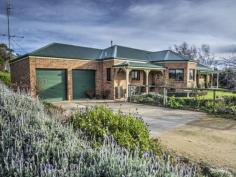  113 Reservoir Road Crookwell NSW 2583 4 bedroom, open plan design, brick home with 9’ ceilings and internal access to double garage.   Large windows with a northerly aspect invite glorious views to the distant hills.  Thoughtfully designed 255m2 home for comfortable, convenient living.  Stunning kitchen with bay windows overlooking the garden and beyond.  Master bedroom with walk in robe and stylish en-suite.  Well appointed 3 way bathroom situated conveniently close to 3 queen size family bedrooms, 2 with built ins.  Home office.   Laundry with floor to ceiling storage, large bench top space.  Gas heating & Air/con.  Big 2 bay colour bond garage (100m2) with high roller doors, cement floor, power, water.  Colour bond steel frame shed (30m2), plus other versatile shedding.  7 acres, 3 paddocks, mature orchard, productive basalt soil, with effective shelter – grow anything.  Fantastic for horses, cattle, sheep, alpaca, excellent water from 5000 gallon tank or town water. 