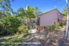 First Choice Property Centre - TAMBORINE MOUNTAIN 12 Jura Court Just you and the birds are here to enjoy this wonderful oasis of peace 
and tranquility, backing onto a nature reserve it will never be built 
out. You will never want to leave, which is a great possibility as 
there is a great space downstairs to work from home. Guest will love 
the downstairs fully self-contained area but be careful because grown up
 children may never want to leave home!! ~ Split level mountain style home ~ Fabulously high cathedral ceilings in the lounge ~ Glass sliding doors to a large covered rear deck ~ Light flooded living with big windows all round ~ Modern kitchen with plenty of bench space & storage ~ Three bedrooms on the upper level with built in robes ~ Freshly modernised bathroom with separate toilet ~ Down to another spacious lounge room with kitchenette ~ Fourth bedroom with window overlooking garden ~ Shower room downstairs ~ Great additional room with an external door to the driveway ~ Sliding glass doors to a lovely covered patio ~ Easy care gardens leading down to a babbling brook ~ Double carport with space to put in a garage if wanted ~ Fully renovated there really is nothing to do here 