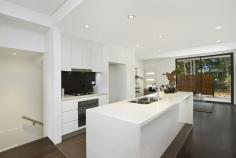  8/23 Myrtle Street Botany NSW 2019 Stunning New Townhouse This brand new North facing contemporary 3 level townhouse is sure to impress, sumptuously finished in a crisp contemporary style, creating a new benchmark for Botany. Located in one of Botany's finest streets opposite the world famous greens of Sydney's elite Lakes golf club, this executive family retreat offers both unequaled luxury and quality design and detail. Move straight in and enjoy this remarkable home. Ground Floor: *Gourmet stone kitchen with delux Smeg Gas cooking and dishwasher *Separate lounge and dining areas both leading to entertainers courtyards *Fully ducted Air-conditioning throughout *Polished floorboards throughout *Guest w/c, internal laundry and direct access to double parking facility First Floor: *2 Large bedrooms with built-ins and balconies *Stunning designer full main bathroom *Study/Media Room perfect for the kids Top Floor: *Master main bedroom of expansive proportions *Master en-suite *Huge Master twin balconies with great cross ventilation A total of 249sqm on title and positioned directly opposite the exclusive Lakes Golfcourse, 50 metres from Botany Aquatic Centre and Booralee Park. 