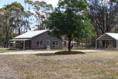  4 Bowen Street Rushworth VIC 3612 With no through traffic, bushland backdrop, town water, mainspower this beautifully presented 2 bedroom, 2 bathroom, open plan living home with delicious kitchen is perfect for your holiday, retirement or permanent living. Stylish low maintenance corrugated iron cladding, 9' ceilings, split system air-conditioning, gas cook top, electric oven, ultra modern vanities too bathroom & ensuite, plus ample workbench & storage in laundry. Landscaped with instant turf, full length front verandah, double carport plus room for veggies, chooks or your own desires. Light, Bright and Too good to miss. 