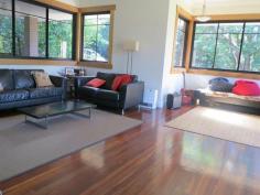 Semi-rural lifestyle with city convenience.!! Park-like, spacious, 
useable grounds with fruit trees, natural bush and extensive parking . 
 900m approx to city train service, restaurant, antique shops, post 
office, general store, community hall and mechanic, parks, tennis courts
 and sporting oval. Walk to highly regarded, child care, public primary school or private school. 3km approx. to a choice of busy shopping centres, pubs and cafes. 
 Extensive bushland walks or mountain bike trails located at the end of 
the street. Shared bicycle / pedestrian path at the front gate. 
Executive style, contemporary home, built for a modern, successful 
lifestyle with views, space and privacy. Frank Lloyd Wright inspired, 
this architect designed 7 yr. old home has the ‘wow’ factor – with 
vistas, light and open plan living, combined with the huge bedrooms, 
ensuite, robes, extensive storage and those other modern essentials that
 make this home a must see. Featuring Jarrah floors, high ceilings, 
super wide eaves, outdoor speakers, tinted windows, paved courtyard, 
underground water tank, under-house storage, sensor lighting and outdoor
 power outlets. The list goes on and on. Energy efficient, 
insulated and low maintenance, the home was built to stringent bushfire 
and environmental standards. Natural gas heating and cooking, vogue 
style kitchen, high speed internet and underground 3 phase power service
 the home, while data and multiple digital TV aerial points abound ( 
including all four bedrooms.) Entry to the property is via a gated 
driveway, lined with established native lilli pillis. There are multiple
 parking areas, plus services available at the swimming pool for the 
visiting caravan or motorhome.
