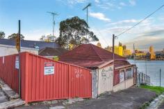  18 Johnston Street Balmain East NSW 2041 Renovator's Delight!!!  * Your opportunity to build your dream home!!! * Absolute waterfront * City Skyline views * Best location * Your own beach * Views of Barangaroo, Darling Harbour and the Anzac Bridge  * Corner block * Tremendous potential * This will get your creative juices flowing!!! * Potential Boat house/studio/gallery below main house on the water!! * So much potential here. * Corner of Johnston St and William St Please note this is a rundown property in need of work and is without a kitchen, bathroom and bedrooms regardless of icons showing otherwise on some websites. 