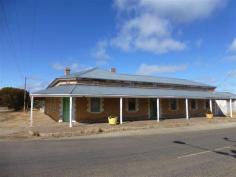  519 Main Street Terowie SA 5421 This spacious stone building includes up to 4 bedrooms, large kitchen/dining area, lounge room, large bathroom and laundry areas. The property has 2 residential entrances plus a shop entrance off the main street. The shop area has polished timber floors and is connected to the main residence. The building is set on a large corner allotment with rear entertaining area, return verandah, car garage/storage shed all with easy main street access. 
