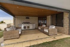  22 Catspaw Ave Beeliar WA 6164 COME FEEL RIGHT AT HOME HERE!! As you walk in the large double door entrance you immediately get that feeling of quality and that you truly are at home. This stunning 4 x 2 family home is situated in the much loved Meve Estate, positioned on the street to capture stunning views of the city and surrounding area.  *Large king size master Bedroom with his and her walkin robe, which leads to a great size ensuite. The ensuite is tiled from ceiling to floor and includes large corner spa bath, vanity, shower, IXL light/heat lamps and separate toilet.   *Remaining bedrooms are all queen sized with carpet, bedrooms 3 and 4 have stunning views and complete with walk in robes. *Outside entrance features cedar lined ceiling with downlights. *Sunken lounge room with beautiful lighting and carpet. *Separate formal dinning area. *Stunning kitchen with large bench top giving plenty of room for a breakfast bench, lots of cupboards including overhead cupboards, stainless steel appliances including electric oven, gas hot top with range hood, dishwasher, double sinks and large pantry. The shoppers entrance allows for easy access. *Kitchen is part of open planned area, over looking another dining area and 2nd lounge which leads to alfresco area.   *Large reverse cycle ducted air conditioner. *Gas bayonet for extra heating is located in the open planned area. *Large linen, big laundry with separate toilet. *Black Butt flooring throughout. *Feature lighting throughout home as well as outside just show the class of this home. *Large paved outdoor entertaining area has cedar lined ceiling with down lights, caf blinds to fully enclose the area and spectacular views.   *There is a great patch of grass but the feature of the backyard is the lower decking area and water feature, fantastic for entertaining and finished with a no fuss garden with automatic reticulation. There is also a rear gate for access from the front. *Large double garage with automatic door with extra room for storage. Located near local shops, primary schools, easy public transport and just minutes to both Cockburn Gateways Shopping and Coogee beach this home is a must see.   