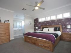 5 Ninghan Lookout Beeliar WA 6164 THIS HOME AIMS TO PLEASE! Why build? It’s all been done here for you! All the extras have been included in this lovely modern 4 bedroom 2 bathroom home. Enjoy a huge master bedroom with ensuite bathroom that features double shower and double basin, plus all bedrooms have built in robes.  Entertain guests in the separate theatre room and open plan living room with raised ceilings, and reverse cycle ducted air conditioning. Create a feast in the gourmet kitchen with quality appliances. There is plenty of storage space and you can save on energy with use of solar panels and solar hot water system with gas booster. Relax in the alfresco area overlooking the delightful reticulated lawn and garden. Situated only minutes from Coles Beeliar Village and Lakefront Beeliar Shopping Centre, along with being close to nearby schools, parks, transport and other amenities, makes this home a great place to live. This home has something for everyone! 