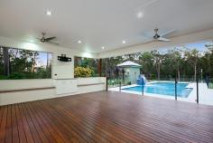  9 Warrandyte Court Camp Mountain QLD 4520 Position is a key feature that differentiates this property from others in the Samford district and indeed acreage properties in Brisbane generally. Only 7 mins to Ferny Grove train station means transit to the city centre and events is easy and quick. Driving time is only 30 minutes to the city. Uniquely situated at the base of Camp Mountain, bordering the D'Aguilar National Park, with nature trails right at your doorstep, lies this hidden gem on 3.75 acres. Privacy is paramount and the new owners will enjoy a chilled and relaxed lifestyle with the assets that abound.  A recent extension by Garth Chapman Queenslanders has created a large 6.8 x 6.5m outdoor pavilion. Such a beautiful space, it has everything you need for entertaining in style built in seating, BBQ with stone bench tops, storage areas and tv points, ready for your widescreen TV. Take 2 steps down from the pavilion and you are in your massive, granite paved sparkling pool area with semi frameless glass fencing, hot water outdoor shower, beautiful water feature and a pump room that is impressive in itself, allowing convenient storage for chemicals, pool toys etc. This will be a place you will be very proud to entertain from.  Adjacent to the pavilion area is the kitchen has had a recent update whilst retaining its farmhouse kitchen styling, with stone bench tops, step in pantry and quality 900mm Smeg freestanding oven and gas cooktop. Large windows open out to a servery, and are conveniently positioned to make entertaining a pleasure.  This majestic north facing Queenslander has 15 foot vented timber ceilings and careful window and silky oak French doors to the wide verandahs. This home is very cool during the summer months and with the use of the ceiling fans has no need of air conditioning.  The family room features a brick open fireplace, ensuring many winter months enjoyed by the warmth of the fireside. The bedroom wing has of 4 bedrooms, 3 of which have new built in wardrobes with custom shelving. These all open out to a rumpus area with floor to ceiling sliding doors which open up to allow further breezes to flow through. The master bedroom is spacious and features a large walk in robe and ensuite with sunken spa bath and sash windows that can be opened up to enjoy the views while soaking the day away.  Downstairs, a recently built 6m x 6m office is perfect for those who work from home with its separate entrance, but could be used as a teenage retreat or media room perhaps? The owner has taken advantage of the lands natural drainage, which allows water to flow to the dam with pumps for irrigation to the gardens and a total of 80,000 litres of water storage ensures you should never run dry. 