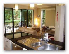  2046/1 The Vistas Drive, Emerald Lakes Beautifully presented with peaceful, leafy views over the fountain to the promenade beyond, this north facing apartment ticks all the boxes.   Set well away from busy roads in “The Vistas”, a secure golfing estate at Emerald Lakes, this is the Gold Coast lifestyle at its best.   The 2 bedrooms are both spacious, the master suite is air conditioned with a walk-in robe, ensuite  and outlooks  to a sunny private courtyard.   The chef’s  kitchen has stunning  black ceasarstone benches,  corner pantry,  gas cook top,  and dishdrawers.    The air conditioned, open plan living areas include a dining / lounge combo and a separate flexi space with plantation shutters to the lounge. Perfect for a TV room, study, music room or some owners have converted this space to a 3rd bedroom if desired.   The beautiful trees lining the promenade provide dappled sunlight and privacy for alfresco dining and sunbathing.   The courtyard has been fully landscaped with hedging , pavers and pebbles for an easy care garden.    There is plenty of room for a small pet as The Vistas is pet friendly with Body Corp approval. For the cars there is a tandem lock-up garage.   Apart from being on the world class golf course, living at The Vistas offers a secure gated lifestyle set among other quality properties and delightful landscaped gardens and trees. There are 2 pools to choose from, a gym, BBQ area and function room, all maintained by on site managers.   Walk or cycle the 11 km of trails around the lakes, take the golf buggy through the tunnel to the shops and cafés in the French Quarter. Well regarded Emmanuel College is directly across the road, and Pacific Fair Shopping Centre at Broadbeach, the Motorway and the rail station at Nerang are also just minutes away.   The owners at The Vistas are a friendly lot and you can be a private or as social as you like as there is an active social club and everyone is welcome.   So phone Janet Houlihan on 0407 841 667 or make sure you come to the open homes this weekend and see for yourself how fantastic life is at The Vistas. But be quick – I sold the last ground floor north facing unit in 1 week! 