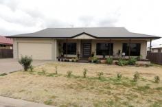 DALBY
ID # 117708743
11 Glen Eagles Drive This quality home built in 2008 with exceptional street appeal, 
excellent pier & beam foundations and within metres from the 15th 
fairway. Dalby's Golf course is a 18 hole golf course with a Club house
 which has full bar and catering facilities. The home is 
outstanding in design with 9 foot ceiling, tiled throughout except for 
the 4 bedrooms + office. The main bedroom has walk-in robe ensuite and 
separate toilet. The kitchen has a central position overlooking the open
 plan living: boasting breakfast bar stainless steel appliances 
dishwasher and plenty of cupboard space. You will also love the 
enormous rear covered deck and roomy North Facing front verandah for 
entertaining. Car accommodation is well catered for with attached double
 garage featuring automatic panel lift door and a detached 6 x6 metre 
color-bond shed with power & concreted floor. There is even a 
separate room for the GOLF BUGGY with its own roller door and easy 
access to power to charge the batteries up for the next round of golf. 