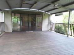  489 Gorge Road FINCH HATTON Qld 4756 Live in a lush tropical paradise amongst the rainforest in this beautifully set 5 acre property with permanent running fresh water stream and tropical low maintenance gardens. Listen and watch the running water cascade over the rocks and stones while you relax on the large under cover timber deck. This home is in excellent condition and includes 4 good-sized bedrooms, 2 with built-ins and main with W.I.R. and ensuite. Also includes a separate office and large open plan living/ dining area. The well appointed kitchen features stone benchtops, gas oven and 5 burner cooktop, dishwasher and pantry. This all opens out to the large, covered entertaining deck area. The eco friendly design boasts extra large eaves with excellent ventilation, solar hot water and solar electricity, ceiling fans and split system air-con to living and main bedroom. Two large water storage tanks and a double bay shed are also included with this property. Call for your inspection. 