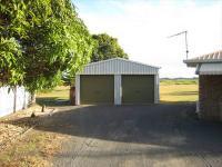  59 Murdoch Road, QLD, 4670 Australia Lowset Brick 3 bedroom with ensuite, big 5000sm block elevated overlooking the sugarcane fields at the rear, double lock up garage with extra carport at the rear for Boat or camper van, above ground swimming pool, no neighbors - one side with macadamia trees, the most amazing sunsets in the afternoon over the Fields. 