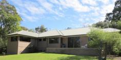 Semi-rural lifestyle with city convenience.!! Park-like, spacious, 
useable grounds with fruit trees, natural bush and extensive parking . 
 900m approx to city train service, restaurant, antique shops, post 
office, general store, community hall and mechanic, parks, tennis courts
 and sporting oval. Walk to highly regarded, child care, public primary school or private school. 3km approx. to a choice of busy shopping centres, pubs and cafes. 
 Extensive bushland walks or mountain bike trails located at the end of 
the street. Shared bicycle / pedestrian path at the front gate. 
Executive style, contemporary home, built for a modern, successful 
lifestyle with views, space and privacy. Frank Lloyd Wright inspired, 
this architect designed 7 yr. old home has the ‘wow’ factor – with 
vistas, light and open plan living, combined with the huge bedrooms, 
ensuite, robes, extensive storage and those other modern essentials that
 make this home a must see. Featuring Jarrah floors, high ceilings, 
super wide eaves, outdoor speakers, tinted windows, paved courtyard, 
underground water tank, under-house storage, sensor lighting and outdoor
 power outlets. The list goes on and on. Energy efficient, 
insulated and low maintenance, the home was built to stringent bushfire 
and environmental standards. Natural gas heating and cooking, vogue 
style kitchen, high speed internet and underground 3 phase power service
 the home, while data and multiple digital TV aerial points abound ( 
including all four bedrooms.) Entry to the property is via a gated 
driveway, lined with established native lilli pillis. There are multiple
 parking areas, plus services available at the swimming pool for the 
visiting caravan or motorhome.