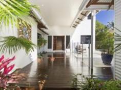 Your dream home is here!!! This stunning 437 m2 residence has been 
designed to enchant with a level of opulence that must be seen to be 
believed. Offers the perfect floor plan for families, combined with a 
wonderful lifestyle, on the river in Idalia. Offering great views in a 
quiet peaceful enviable location!!! This home is a genuine opportunity 
like no other to own a statement home, in which meticulous design and on
 entering this much loved Balinese residence, has the feeling of 
elegance and charm and is immediately apparent. This 2 storey 4 
bedrooms, 2 bathroom residence has a very large open plan living area on
 the top level opening onto large front deck for large family 
gatherings. Gourmet kitchen with large breakfast bar, stone bench tops, 
double oven and large walk-in pantry the full length of the kitchen. 
Media/family room plus separate granny flat for Mum or teenagers 
retreat. Tropical resort style in-ground pool with low maintenance 
gardens and on a 804 m2 allotment. 3 car accommodation, large workshop,
 plus room to park a boat/caravan inside the property. Out your front 
gate and you are on the walkway beside the river. Watch the canoeists 
row by or just put a line in to catch dinner.
 Great views across the River and over the Golf Course and Mt Stuart. Inspection is an absolute must.
 What a lifestyle on offer here!!!
