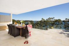 15 The Lambeth Walk Bundeena NSW 2230 The Ultimate Beach House From
 the moment you enter and see the stunning water feature at the front 
door, you know this brand new home been designed for ultimate glamour 
and lifestyle. The three levels hug the cliff-face providing northerly 
water views from almost every room. Watch the property video to really see how special this house is. From
 the huge open plan living and dining area you'll be drawn to the focal 
point of this amazing home - the covered terrace with 180 degree views, 
outdoor kitchen and glass balustrades. Downstairs, the master 
suite has walk in robe, extra built-ins, ensuite and private balcony 
overlooking the water. The guest room also has a luxurious ensuite and 
built-in robes. On the ground floor there's a games room with 
space and lighting for a full sized billiard table, a wet bar with tiled
 feature wall, as well as extra storage and the laundry. From the
 level lawn, there's direct access to Gunyah Beach via your private 
sandstone staircase. Boat moorings are possible, dependant on 
availability. Key Features: Kitchen is fitted with 80mm 
Caesarstone benchtops, European appliances including induction cooktop 
with induction wok, huge island bench, Schock sink, butlers pantry and 
glass splashbacks Technology - energy-saving recessed LED lighting, 
zoned Sonos system throughout the house, zoned ducted air-conditioning, 
data and Foxtel ports in almost every room, video security intercom with
 units on all three levels. Remote control external shutters on the western windows Built-in combustion fireplace and surround sound in the lounge area Floors are secret-nailed Southern Beech, sandstone used throughout for capping, garden beds and feature walls Ground floor games room has ceramic feature wall, bar area, cedar ceilings plus laundry and extra toilet Landscaped backyard features a hot and cold outdoor shower, stairs to the beach and storage for personal watercraft Rainwater tanks and gas fittings throughout for heating The
 satisfaction of living and entertaining in this home is second to none.
 If you'd like to experience the ultimate beach house, call me to 
arrange a private viewing.