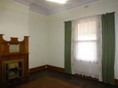  11 West Terrace Orroroo SA 5431 This classic return verandah villa is situated in an ideal residential location and offers 3 spacious bedrooms all featuring ornate fireplaces. There is a magnificent arched hallway with front stained glass windows plus the home still has its original doors and skirtings adding to lovely retained character of the home. Beautiful ornate ceilings are also featured throughout the home. There is a formal dining room with ornate fireplace plus a huge lounge/family room also featuring an open fire place and reverse cycle air conditioning. The kitchen with casual dining area offers ample space and storage plus a reverse cycle air conditioner. The home has two bathroom areas with the main bathroom featuring a separate shower and claw foot bath. A separate inside toilet and large laundry area completes the inside of the home. Outside includes the return bull nose verandah, approx. 1500 gallons of rainwater storage, stone garage and storage shed which along with the home are all set on a large level allotment with the original stone fencing along the front boundary. Inspection of this home is highly recommended.  