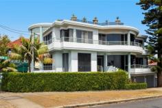 2 Denning Street, South Coogee Prime position, opposite parklands and never to be built out ocean and coastline views. 
 
Nothing has been spared in this quality built home that oozes class and 
style, from the granite floors to the Waterford crystal chandeliers. 
 
Spanning over three levels, this home was built for the large family with entertaining in mind. 
 
Entry level, with granite tiles throughout the casual and dining areas with direct access to large balcony and amazing views. 
 
Formal and informal living areas, fabulous kitchen, granite bench tops, integrated fridge and loads of storage. 
 
Top level consists of 4 spacious bedrooms, all with built-in robes. 
 
The main bedroom (parents wing) with retreat area, full sized bathroom with spa and double basins and pear wood robes. 
 
A second bathroom accommodates the remaining three bedrooms, laundry shute and walk in linen cupboard. 
 
Lower level, triple garaging, fully tiled, bathroom, sauna and leafy garden complete with pizza oven. 