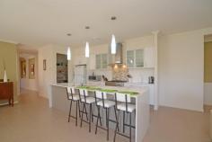 4 Grampian Ct Reedy Creek QLD 4227 37 Square Single Level Designer Home For Sale - $849,000 Ideally
 located in the Observatory this sensational five bedroom, three 
bathroom single level home is 37 squares and features all the quality 
inclusions that one would expect in a display home. The chef's designer 
kitchen boasts stone bench tops, quality stainless appliances, a large 
island bench, a 900mm gas cook top and a walk in pantry. This 
beautiful home offers multiple living areas and will most certainly suit
 the growing family that likes to entertain. The five spacious bedrooms 
all have built in robes with the master featuring a walk in robe and a 
luxurious ensuite with a spa bath. This home boasts three full 
bathrooms, a media room, a formal lounge room and an open plan family 
room that adjoins a large alfresco dining area that overlooks the 
sparkling in ground pool. Ducted reverse cycle air conditioning, a 
ducted vacuum system, fly screens and quality window furnishings are all
 standard inclusions with this magnificent home which means when you 
move in you will have nothing to do and nothing to spend. There is a 
grassed area for the kids and pets and the property is fully fenced and 
professionally landscaped and most of all it is low maintanence. This is a must see home if you are looking for quality, style and above all location. 5 Spacious Bedrooms – 2 Ensuited 3 Full Bathrooms Chefs Designer Kitchen 3 Living Areas plus Dining Area Media Room Ducted Reverse Cycle Air Ducted Vacuum System Security System In Ground Salt Water Pool Rain Water Tank & Garden Shed Block size is 948sqmts Fully Fenced & Landscaped