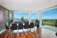  2 Weaver Terrace Bulli NSW 2516 Sophisticated Ode to the Sea Surely this is the most illustrious and coveted location in the Illawarra. Uninterrupted panoramic views provide a survey of the coast, from the world-class waves of Sandon Point to the magnificent rise of the escarpment and the misty curves of the coastal bays. This home is a sophisticated ode to the many seasons and moods of the sea. Designed so that every room reveals an expansive view, it feels like you are in a gallery devoted to the stunning swells of the south coast.  Reflecting the grandeur of its landscape, this home is palatial in its proportions. Set over two spacious levels with five double bedrooms, three bathrooms, two living areas, a large entertaining deck, wrap around first floor balcony, a two-car garage and three-car driveway. Cleverly designed to maximise the views while retaining complete privacy.  An unmatched north facing corner block with the blue horizon of the Tasman Sea to the north and lush green lawns of Sandon Point Reserve to the east, your views will never be built out. With the beach at your doorstep, your toes can meet with the sand and sea everyday while the dog gets a good workout. Hit the cycle track and run to your latte in Thirroul or ride to your office in Wollongong. If you can bear to leave for work, there is quick and easy access to Bulli Pass with just an hour to Sydney. But when you get home park the suit, break out the boardies and soak up the sun.  Weaver Terrace is named after William Weaver who designed and built the tramway line between Bulli and Sandon Point and the famous Sandon Point jetty. This slice of coast was the hub of an industry on which the Illawarra was built. Taking a cue from its past, the home has been conceived with an industrial modern aesthetic. Embracing the changing scenes of the sea while being uncluttered and open.  Architecturally designed, this home sits beautifully within the landscape and is constructed so that its beauty will be retained forever. Marine grade and cutting edge technology ensure a home that can tame the elements with ease. Using the finest locally sourced materials combined with luxury fittings and finishes makes for a sumptuous atmosphere. This is a rare property of uncompromising quality, no expense has been spared and every detail has been carefully considered.  Please refer to attached spec sheet and floor plan for full details. 