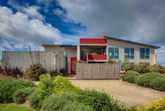 22 Ruthledge lane Port Fairy VIC 3284 Positioned on 18 Acres, this magnificent home of grand proportions, offers the ultimate experience in spacious luxury living, whilst providing the utmost in privacy and creating the perfect environment for harmonious modern living. Designed to take full advantage of the surrounding landscape, the expansive use of glass provides fantastic views that are captured at every turn blending the indoors seamlessly with the outdoors. Thoughtful planning has resulted in a floor plan that provides multiple living zones to cater for everyones needs. The ground floor is a wonderful haven for children and guests offering 3 bedrooms, large sumptuous bathroom, guest powder room and a separate living room which flows out to a sheltered courtyard. The upper level is even more accommodating offering an indulgent master suite including ensuite and walk in robe with another guest powder room just down the hall. The second living room features large windows framing views of the nearby dunes and a gas log fire brings warmth in winter. The impressive dining/kitchen area is of open plan with the main attraction being a striking, streamline fully equipped kitchen using the highest quality cabinetry, granite bench tops and stainless steele appliances, which is sure to impress the most seasoned entertainer. There is also a large walk in pantry and a discreet home office tucked away in the corner. Another outdoor courtyard is conveniently located close to the kitchen and a crowâ€™s nest adds an element of difference allowing views of the Ocean. Outside the garden has been been fully landscaped for easy care and there are a few paddocks suitable for horses or livestock. A huge 4 bay shed has a workshop with 3 phase power and a double garage provides parking for two vehicles. Located close to Killarney within a short drive to Port Fairy this wonderful home is immaculately presented both inside and out with simply not a thing to be done except to move in and enjoy its stunning surrounds.
