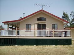  49 Gehrke Rd Glenore Grove QLD 4342 Here is a great opportunity for you to own your own piece of country seclusion on 7 acres and only a short drive to Plainlands shopping centre and 35 minutes away from Ipswich CBD. A lovely country style home with full length front verandah is situated in a high position on a gentle slope and overlooking the dam. Your privacy here is assured as there are no close-by neighbours. The home features a solid timber kitchen of New Guinea Rosewood with Spotted Gum bench tops – the envy of every cook. The spacious open plan living rooms have cathedral ceilings and french doors opening to the verandah as well as polished timber floors (Spotted Gum), air conditioning and a wood heater for the chilly winter months. Extras include Pink Batts in the ceiling, security bars, ceiling fans, whirly bird on the roof and a covered walkway to the 2 bedroom, fully self-contained granny flat – ideal for the relatives, as a teenagers retreat or as a large rumpus/entertainment room. There is also a double carport, storage shed and a dog enclosure. This property has so much to offer, close to highway access, but not close enough to hear the noise. Tranquil and peaceful – once you come to inspect, you won’t want to go home. Call Sue today to arrange your country visit. 