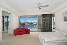  1008 Edgecliff Drive Sanctuary Cove QLD 4212 - 	 4 ensuited bedrooms, including guest bedroom downstairs - 	 5th bedroom adjoining master suite - perfect as nursery, parents retreat or hobby room - 	 Master suite boasts huge bedroom, ensuite with double sinks, shower with doubles shower heads, bath and walk-in robe with cabinetry, adjoining office with built-in desks and cabinetry, and balcony with water views - 	 Great kitchen with curved stone benchtops, loads of storage, inbuilt wine fridge, high end appliances including built-in steamer, oven and grill, and microwave - 	 Kitchen also features fabulous butlers pantry with dishwasher, sink and server - 	 Open plan living flowing from kitchen and looking out to waterfront - 	 Desirable North-to-Water position - 	 Sweeping harbour front views - 	 Formal dining on raised circular platform with polished timber floor, featuring spectacular chandelier - 	 Media room with dark plush carpet - 	 Floor-to-ceiling glass sliding doors along whole back of house - doors regress completely into wall for true seamless indoor/outdoor living - 	 Awesome outdoor entertaining area overlooking the waterfront, with built-in bench with sink, BBQ and rangehood, and storage - 	 Open-air sundeck on waterfront - 	 Inground tiled pool with glass fencing - 	 Floating pontoon with power, light and water - 	 Ducted air conditioning - 	 Home automation system - 	 Bedrooms all screened with ceiling fans - 	 3 bedrooms feature walk-in robes, 4th bedroom with built-in robes This impressive home is located in the prestigious secure estate of Sanctuary Cove. With 24 hour security, and premium facilities such as members only golf club, rec club and gym and world-class golf courses, you will love living here. Enjoy the buggy lifestyle with easy access to the shops and restaurants in the Sanctuary Cove Village.  