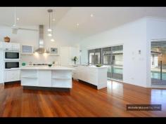  4 GAYNA STREET, KENMORE EXECUTIVE POOLSIDE ENTERTAINER Busy professional families will adore this modern feel and generous size of this special two level residence located in a secluded cul de sac.  The convenience, so close to shops, buses, schools and ability to commute north and south of the CBD makes this a perfect family option.  Designed with the pool as the central showpiece and loads of glass to capture cross breezes and natural light.  With 2 large bedrooms upstairs separated by a breezeway and adjacent to the third bathroom. While the main suite with ensuite and generous walk in robe plus fourth bedroom near the second bathroom is on the ground level.  The home office is a superb size and well located.  The large lounge and dining can be separated from the other lounge. It also leads out to the poolside patio and looks to the trees on the other side.  The beautiful kitchen is exceptionally spacious and has raked ceilings, island bench, rich timber floors and is open to the large family room and casual meals area.  There is a private covered deck on one side and more sliding doors leading to the entertaining area with high umbrella.  There is loads of storage plus a 3 car lockup garage straight in from the street.  Great value and immaculate presentatioD
