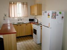  4 Wine Drive Wilsonton Heights Qld 4350 Duplex Unit Block $425,000 Each of the 2 units has 2 built-in bedrooms, open plan kitchen and living area and a lockup garage. They have a North-Easterly aspect, handy to schools, parkland and shopping centre. Currently rented for a total of $430/week. There has been some recent renovations. 