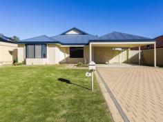  16 Hapuna Street, BUTLER WA 6036 This well designed family home, situated in an ideal location, has just been freshly painted, new soft carpets laid and window treatments upgraded. A modern neutral colour palette has been utilised throughout and an abundance of natural light filters through the entire house adding to the freshness. The open plan living zone is simple and functional, with easy care bamboo laminate flooring and large glass sliding doors opening to the outdoors and paved pergola area. A second living or lounge area is situated at the front entrance for separate entertaining and enjoyment. The user friendly kitchen has a gas cooktop, electric oven, double stainless steel sink and ample bench and cupboard space. A built in fridge recess keeps this area streamlined. A shoppers entrance direct from the double carport makes access simple. All 4 bedrooms have brand new soft carpet in grey tones, and the Master bedroom has a walk in robe and ensuite. The family bathroom has a bath tub, separate shower and vanity. The laundry has its own access to the side of the house, where the clothesline is situated. The back garden requires some designing and landscaping, however, is well sized for the family to enjoy and adapt to individual needs. IGA Supermarket, East Butler Primary School, Brighton Catholic Primary School, parks and transport are situated within a 1km radius and offers easy access to Joondalup. 