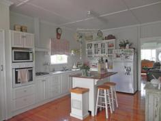  82 Atthow St Kilcoy QLD 4515 This beautiful 3 bedroom weatherboard home is situated in one of Kilcoys
 best positions. Close to the Golf course and hospital and perched up 
high enough to take in the glorious mountain views and catch the cooling
 afternoon breezes. 
 The home itself has a wonderful warm feel about it and has been 
lovingly and thoughtfully renovated to recreate the cosy feel of 
yesteryear. The kitchen is a chefs delight with plenty of bench space, 
and a gas cook top. The adjoining dining room is airy and spacious and 
opens onto the deck which is perfect for entertaining. A private roomy 
lounge and two good sized bedrooms (both with built ins) and bathroom 
complete the upstairs. The upper level of the home features gleaming 
polished timber floors. Down stairs is the third bedroom with ensuite ( 
perfect for the teenager or elderly parents), laundry and room for 
entertaining and car accommodation. 
 The home sits on a 993 sq mtr corner block is partially fenced and has low maintenance gardens. 