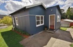 14 Wilga St Bondi NSW 2026 This cute original Captains Flat miners cottage is an excellent investment or first home. The property was built in the 1940s by the Mining company, Lake George Mines. It was one of 152 homes built to accomodate married miners. Built with hardwood frames and iron roof, this fibro cottage has been freshly decorated and has manicured gardens. We expect to see 280 to 300 dollars per week for rental.  When you first see the home, Georgian timber windows feature alongside the entrance steps and balustrade. The living room is bright and full of character. The picture rail, panelled ceiling and the timber windows are all freshly decorated and add to the cottage features. There are two great size bedrooms, one bedroom has direct access to the two way bathroom. A large kitchen has plenty bench space and flows through to the large laundry, separate toilet and back porch.The property has recently had installed a reverse cycle air con unit,which is great for summer and winter. 