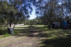  915 The Entrance Rd Wamberal NSW 2260 One Acre - Main Road Exposure House - Property ID: 728097 Level, one acre lot surrounded by council reserve land with direct main road exposure. Less then one kilometre to beach. Three bedroom elevated home with large machinery shed. 