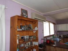  3 McDougall Street, Warwick QLD 4370 This 2 double bedroom home has a family bathroom with a separate toilet and laundry. Open plan kitchen/dining/lounge room with a freestanding stainless steel gas/electric stove, reverse cycling air conditioning and wood heating. Front deck and covered rear deck. Double powered shed, 2x garden sheds, 2x rainwater tanks and raised garden beds. Solar heating and fully fenced with colourbond fencing and situated on a 1012m2 allotment. 