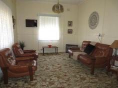  33 King Street GLOUCESTER NSW 2422 For over 60 years this family home has gathered family memories. Mostly in original condition, in good order and well maintained this terrific four bedroom home is located right in the heart of Gloucester. The lounge is spacious and there is a separate dining area. The kitchen is easily accessible, functional and has been upgraded since the home's construction. The bathroom is original and as they say “retro” is fashionable. 