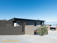   1/33 Waverley Street, Bellerive TAS 7018 This modern family home enjoys breathtaking panoramic views of the Derwent River and the Mountain beyond from its highly sought after location. Set over two levels to maximise practical living spaces it offers a stunning outlook from the upstairs living and dining area, a generous kitchen that has been well designed and features top end appliances, ample bench and cupboard space and a private sitting area adjacent. Generous decks and paved entertainment areas have been set out around this home to make the most of all weather entertaining. 