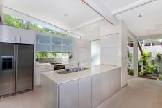  21 Upolu Esplanade Clifton Beach QLD 4879 Superior Architecturally Designed Beachside Residence House - Property ID: 711221 This stunning executive style home has been architecturally designed to allow for a multiple of uses - family or holiday home, work from home situation or retired couple. Located right on the Esplanade - short stroll to the beach, parkland and walk ways. The whole package is simply outstanding - the right location with one of the best designed houses we have inspected in years. * Absolute quality construction inside and out, utilizing a blend of different timbers, iron and block. * Yes! this is a Circa 2000 - David Quigley Home. * Unique pavilion style and fully air-conditioned. * Fully self contained guest pavillion. * Stunning open air outdoor entertaining area with spotted gum timber deck and shade sail - providing full protection from the weather. All rooms of the home open up onto this beautiful internal surrounding. * 3 large bedrooms plus the guest room, with main bedroom overlooking garden & winter creek. * 3 bathrooms including stylish ensuite to main bedroom. * Built ins to all bedrooms with the main containing a huge walk in robe. * Modern kitchen with gas cook top, Meile appliances incl dishwasher, soft close cupboards and durable stone bench tops. * Open plan living room containing full length side views to garden and winter creek, built in electronic cupboard - ideal to hide all those wires and components. * High ceilings and openness created through out due to the Riteck roof system. * Well designed for the tropics with cross flow ventilation via full length opening windows and louvers. Being elevated off the ground also allows for underneath air flow. * Cool modern heated freshwater pool situated in the middle section of the home and deck area - pool also has 3 waterfalls. * Large internal laundry with 9 cupboards. * Double lock up garage with extended work shop area, plus double side gates for boat/camper trailer parking. * Guest room is multipurpose and could easily be used as office, gymnasium, fourth bedroom or rent it out separately as it has its own private entrance. * Seller will rent back for 12 months. The sellers instructions are to sell now as they wish to create another amazing dream home nearby. This property is very unique and functional so inspect today and secure your private paradise.  Print Brochure Video Email Alerts Features  Land Size Approx. - 600 m2 