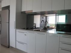 11403 8 Harbour Rd HAMILTON Qld 4007 This modern one bedroom apartment is perfectly situated in the heart of the prestigious Hamilton vicinity boasting resort style living including an infinity pool and barbecue area set amongst lush tropical gardens. This one bedroom apartment has a real sense of space with its floor to ceiling glazing showcasing the suburban views of Ascot and Hamilton. At the centre of the open plan design, lies the linear style kitchen. Its contemporary design is ideally matched with quality appliances. The alfresco balcony is perfect for entertaining. The innovative bi-fold windows ensures that this area can be used in all weather types and provides a separate dining area. The queen sized bedroom features mirrored built in wardrobes with blockout blinds. In the bathroom you'll find a stone topped vanity and quality fixtures. The apartment is also wired with fibre optic cabling to keep your apartment abreast of advances in communication and entertainment technology, well into the future. Offering an abundance of accessible shops within the precinct including Woolworths, Domino's Pizza, Coffee Club, Shinzhen Sushi to name a few and a 3 minute walk to Portside Wharf and Racecourse Road Village, the location is perfect. 