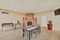  29 Derna Road   Robinvale   Vic   3549 Not only are there heaps of rooms but they're all much larger than average. Set on approx. 1 acre is this 4 year old 50.4 sqm UMR home. 3 large bedrooms - BIR plus Master with over sized ensuite. Kitchen features chef's stove, huge WI pantry & loads of bench space. The open dining & family area overlook the grassed fully fenced yard. Formal entry & Sep lounge room, also a TV room/study. Sweeping verandas, 3 phase ducted R/C air con, Dbl garage with extra toilet. Space for a vegie garden under watering system. Water storage is no problem with 2 x 23,000lt tanks to cater for your 3 Megs & rain water. The entertainment area comes complete with BI brick fireplace. To complete this package is the man shed approx 7.5 x 12m, concrete floor, kitchenette, 3 phase power. A real man's cave!. You will find all this & so much more on this property. Only minutes from Robinvale. An inspection will impress. 