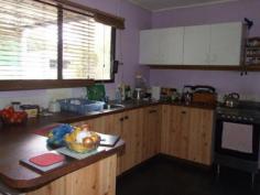  3 McDougall Street, Warwick QLD 4370 This 2 double bedroom home has a family bathroom with a separate toilet and laundry. Open plan kitchen/dining/lounge room with a freestanding stainless steel gas/electric stove, reverse cycling air conditioning and wood heating. Front deck and covered rear deck. Double powered shed, 2x garden sheds, 2x rainwater tanks and raised garden beds. Solar heating and fully fenced with colourbond fencing and situated on a 1012m2 allotment. 