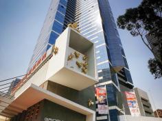  6003/7 Riverside Quay Southbank VIC 3006 Maximising wraparound Albert Park, MCG, Botanical Garden views to bay view, this resort style skyhome reveals a scenic retreat graced with a cleverly integrated in/outdoor design to bask in the vibrancy of Melbourne from each and every window.  The defined living and dining areas capture picture views and soak up an abundance of natural light. An open granite kitchen is equipped with Miele appliances and seamless cabinetry.  Residents enjoy access to a premier selection of facilities including a gymnasium, pool, sauna, private cinema, 24 hour concierge and video intercom and lift access.  The double-sized bedroom includes wide built-in wardrobes and direct access to a stylish ensuite. Additional features include a separated laundry, guest powder room, ducted air conditioning, chic downlights and single carport. It represents a remarkable investment opportunity for those seeking an unparalleled lifestyle location with popular demand and a high rental yield.  It is proudly set on the 60th floor and enviably located within easy walking distance to sports venues, Crown Casino, Arts precinct, Southbank shops, cafs, restaurants and transport options. 	 