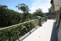  10 Palmtops Ave Elizabeth Beach NSW 2428 Modern, Sunny, Tenants in Place Envied setting overlooking bushland Positioned atop the hill between beach & lake Double brick construction with tiled balconies Open plan living with ample natural light Level access in from street + second living area Filtered lake views - VENDOR MOTIVATED This modern double brick residence awaits your inspection in beautiful Elizabeth Beach, just minutes to both the sand 'n' surf and Wallis Lake.With an elevated, filtered lake aspect and brilliant sunshine year round it features:- Main bedroom with walk in robe and bathroom- Open dining and living with access to tiled balcony- Sunny kitchen with stainless steel appointments- Two additional bedrooms with BIRs and second bathroom- D/stairs living/rumpus with lower deck- Landscaped gardens- Level access into double garage/house from street- Scope to add fourth bedroom or study off rumpus room if requiredSurrounded by quality new homes and sitting atop the ridge between Elizabeth Beach and Wallis Lake, this is an ideal location set away from the busy holiday crowds making it desirable as a permanent living address.Long term tenants in place.Please call Mark Lawson om 6554 0600 or Greg Hope on 6554 0666 for details. 