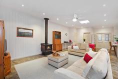  32 Wandarra Way Warranwood VIC 3134 4333Price Guide: More than $670,000   |  Land: 652 sqm approx 	   |  Type: House  |  ID #111891 Barry Plant Ringwood T 03 9870 5555 EMAIL OFFICE Nicole Freene T 03 9870 5555  |  M 0448 877 387 EMAIL AGENT Aaron Chuah T 03 9870 5555  |  M 0408 828 000 EMAIL AGENT Details Map/Directions Area profile   Carefully Designed To Offer The Ultimate Family Lifestyle From its quiet cul de sac location to the carefully planned two-storey floorplan, much thought has gone into creating this gem of a home that truly offers the ultimate family lifestyle. Careful consideration has gone into every aspect of this home to ensure its durability for everyday family living and ability to entertain on a very grand scale. It's therefore no surprise to note that large families are comfortably catered for within this space-laden home, which boasts three separate living areas along with a magnificent entertaining terrace that's virtually another room in itself! The home's grand persona is portrayed in the flowing sense of space shared by each of its radiant living areas, which maximise space and suited for a host of living requirements. Evoking the charm of a country lifestyle with its leafy surrounds and tranquil ambience, leadlight windows adorning the top of large, frameless windows are definitely in keeping with the home's period-inspired theme. Grand open-plan living with a large, well-appointed kitchen and family living with wood combustion fireplace makes for a superb centrepiece and combines with the spectacular wrap around deck that floats amongst the treetops, delivering the perfect indoor-outdoor entertaining set-up or peaceful sanctuary for that afternoon escape. While on the topic of peaceful sanctuaries, the light-filled formal lounge (with adjacent dining) frames pleasant front garden views as you unwind with a book in hand; teenagers, meanwhile, have a downstairs retreat to call their own. And with its own entrance, access to a large bedroom (with built-in robes) and brand new bathroom facilities on hand, it's also dressed with the flexibility of multi-generational living. Bedrooms of generous proportions delight with their comfort and space, while a huge amount of storage in and around the home promotes clutter-free living. Finished with gas ducted heating plus split-system heating and cooling and boasting a family-friendly location within excellent access of well-regarded private schools, scenic parkland, Eastland Shopping Centre and Eastlink 