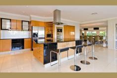  Carrara QLD, 4211 This prestige home enjoys a separate two bedroom guest residence, swimming pool, floodlit championship tennis court, helipad and 75 meter river frontage across the Nerang River to The Royal Pines Resort with sweeping 200 degree north-east views. Celebrity House is only ten minutes from Pacific Fair on Queensland's Gold Coast and the beaches of Surfers Paradise. Set on two prime acres on two titles, this expansive home of 100 squares now exquisitely reappointed, offers an idyllic waterfront lifestyle with direct Broadwater access and the freedom of absolute privacy for a large family & their guests. 